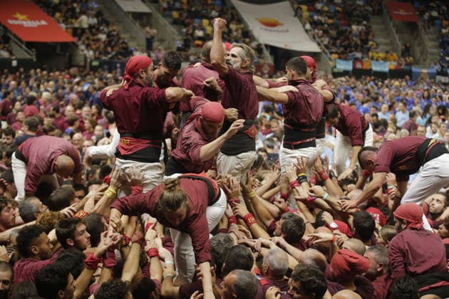 Human tower groups perform in the 30th Concurs de Castells competition in Tarragona TARRAGONA, SPAIN - OCTOBER 3: Members of human tower groups (colles) build intricate human towers (castells) during the competition section of the 30th Concurs de Castells at the Tarraco Arena Placa in Tarragona, Spain on October 3, 2026. The biennial event, recognized as UNESCO Intangible Cultural Heritage, gathers top teams from across Catalonia to construct towering multi-tiered human structures. Senhan Bolelli Anadolu Tarragona Spain. Editorial use only. Please get in touch for any other usage.  Copyright: x2026xAnadoluxSenhanxBolellix
