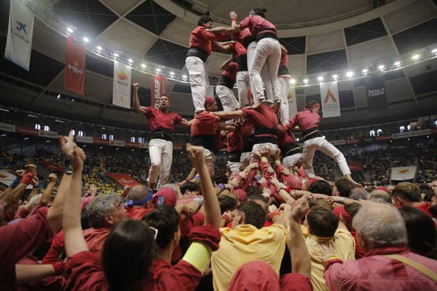 Human tower groups perform in the 30th Concurs de Castells competition in Tarragona TARRAGONA, SPAIN - OCTOBER 3: Members of human tower groups (colles) build intricate human towers (castells) during the competition section of the 30th Concurs de Castells at the Tarraco Arena Placa in Tarragona, Spain on October 3, 2026. The biennial event, recognized as UNESCO Intangible Cultural Heritage, gathers top teams from across Catalonia to construct towering multi-tiered human structures. Senhan Bolelli Anadolu Tarragona Spain. Editorial use only. Please get in touch for any other usage.  Copyright: x2026xAnadoluxSenhanxBolellix