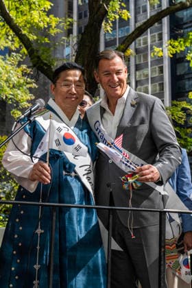 October 3, 2026, New York, New York, USA: US congressman TOM SUOZZI poses for a photo with a fellow grand mashal on the 2026 NYC Korean parade stage. New York USA - ZUMAh214 20261003_znp_h214_015 Copyright: xSDxHerzogx