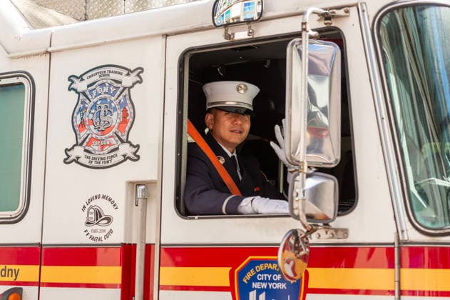 October 3, 2026, New York, New York, USA: A fireman drives by in his firetruck at the 2026 NYC Korean parade. New York USA - ZUMAh214 20261003_znp_h214_042 Copyright: xSDxHerzogx