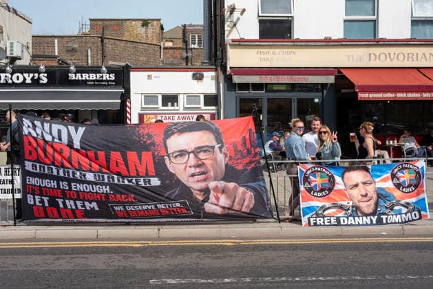 October 3, 2026, Dover, United Kingdom: Two banners installed on the fence near the Golden Lion pub during a demonstration in Dover. The left banner shows a photo of the UK Prime Minister, Andy Burnham and the right one shows a far-right activist Danny Tommo (Daniel Thomas). Supporters of the English Defence League (EDL) gathered in Dover, UK to march through the town all the way to the harbour. English Defence League is an extreme far-right and Islamophobic organisation. It was founded by Tommy Robinson (pseudonym of Steven Yaxley-Lennon) in 2009. Dover United Kingdom - ZUMAs197 20261003_aaa_s197_245 Copyright: xKrisztianxElekx