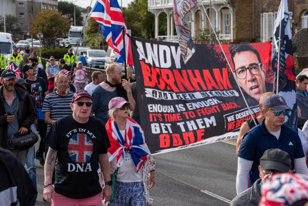 October 3, 2026, Dover, United Kingdom: Far-right protesters march with banner and flags to the harbour during a demonstration in Dover. Supporters of the English Defence League (EDL) gathered in Dover, UK to march through the town all the way to the harbour. English Defence League is an extreme far-right and Islamophobic organisation. It was founded by Tommy Robinson (pseudonym of Steven Yaxley-Lennon) in 2009. Dover United Kingdom - ZUMAs197 20261003_aaa_s197_256 Copyright: xKrisztianxElekx