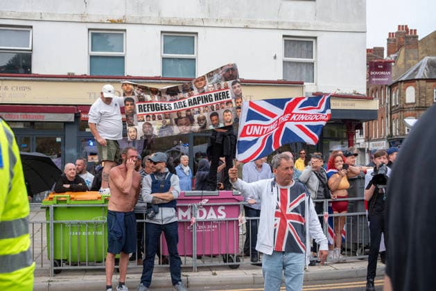 October 3, 2026, Dover, United Kingdom: Far-right protesters hold a banner and wave a St George s flag during a demonstration in Dover. Supporters of the English Defence League (EDL) gathered in Dover, UK to march through the town all the way to the harbour. English Defence League is an extreme far-right and Islamophobic organisation. It was founded by Tommy Robinson (pseudonym of Steven Yaxley-Lennon) in 2009. Dover United Kingdom - ZUMAs197 20261003_aaa_s197_268 Copyright: xKrisztianxElekx