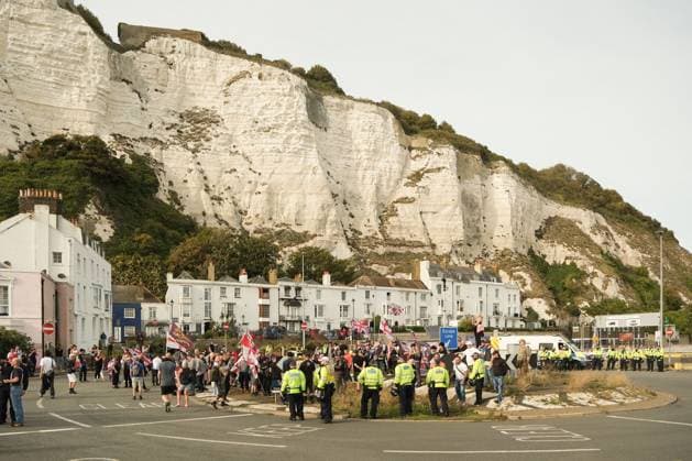 October 3, 2026, Dover, United Kingdom of Great Britain and Northern Ireland: DOVER, UNITED KINGDOM, OCTOBER 3, 2026: Anti-immigration protesters and anti-racism counter-protesters gather during rival demonstrations in Dover, Kent. Anti-immigration demonstrators carrying Union flags and St George s flags displayed banners calling for deportations and an end to small-boat crossings, while counter-protesters gathered nearby. Police maintained a significant presence between the groups and monitored the demonstrations. Dover United Kingdom of Great Britain and Northern Ireland - ZUMAq101 20261003_zna_q101_205 Copyright: xMarcxLewisx