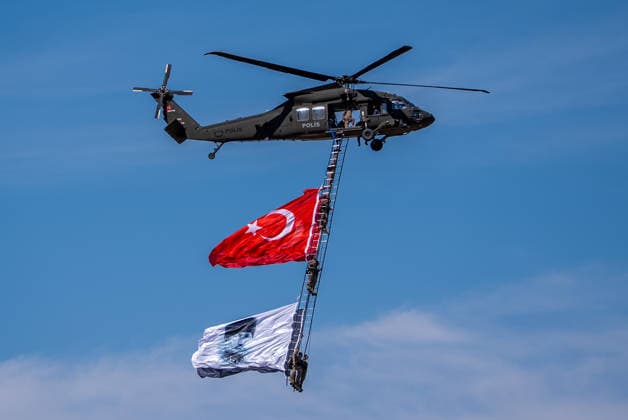 TEKNOFEST Southeast in Turkiye s Sanliurfa SANLIURFA, TURKIYE - OCTOBER 4: Soldiers aboard an S-70 helicopter wave a Turkish flag during a flag flyover at the Aviation, Space and Technology Festival (TEKNOFEST), world s largest aviation, space, and technology festival at the Sanliurfa GAP Airport for its 15th edition in Sanliurfa, Turkiye on October 4, 2026. Arman Onal Anadolu Sanliurfa Turkey. Editorial use only. Please get in touch for any other usage.  Copyright: x2026xAnadoluxArmanxOnalx