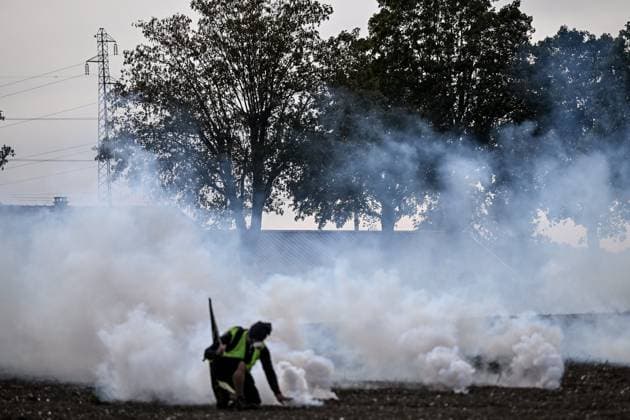 PROTEST AGAINST PESTICIDES PHOTOPQR OUEST FRANCE Martin ROCHE Saint Pierre la Garenne October 3, 2026 This Saturday, October 3, 2026, a protest against pesticides is being held in Saint-Pierre-la-Garenne, Eure, Normandy. In the massive procession, farmers, patients, healthcare workers, and citizens demanded the closure of production sites such as Syngenta’s. The rally was organized by an unprecedented coalition: the Confédération paysanne, Les Soulèvements de la Terre, the Cancer Colère association, and the Collectif de soutien aux victimes des pesticides de l’Ouest (CSVPO). Here, protesters face the large police presence separating them from the Syngenta factory, were quickly tear-gassed with numerous tear gas canisters and GM2L gre Copyright: xPHOTOPQR OUESTxFRANCE MAXPPPxMartinxROCHEx 20261004OFR7226 20261004OFR7226