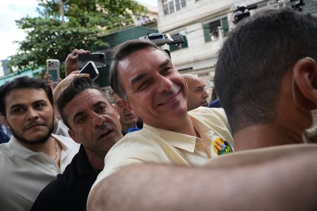 October 4, 2026, Rio De Janeiro, Brazil: RIO DE JANEIRO, BRAZIL, OCTOBER 4, 2026: Brazilian presidential candidate Flavio Bolsonaro of the Liberal Party (PL) arrives at a polling station in Rio de Janeiro to cast his ballot during the first round of Brazil s presidential election. Bolsonaro greeted supporters and spoke to reporters before voting as polling got underway across the country. Photo: JNA PRESS Rio De Janeiro Brazil  - ZUMAq101 20261004_zna_q101_028 Copyright: xMarianaxGreifx