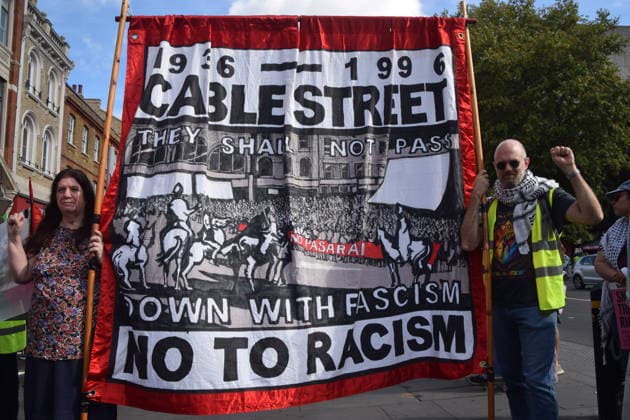 October 4, 2026, London, England, United Kingdom: Protesters gather in Whitechapel during the march to Cable Street against racism and fascism, marking the 90th anniversary since the Battle of Cable Street. London United Kingdom  - ZUMAv130 20261004_zip_v130_005 Copyright: xVukxValcicx