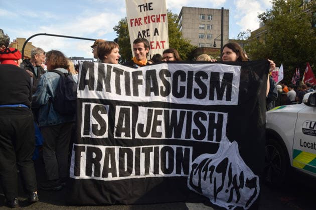 October 4, 2026, London, England, United Kingdom: Protesters hold an Antifascism is a Jewish tradition banner during the march to Cable Street against racism and fascism, marking the 90th anniversary since the Battle of Cable Street. London United Kingdom  - ZUMAv130 20261004_zip_v130_008 Copyright: xVukxValcicx