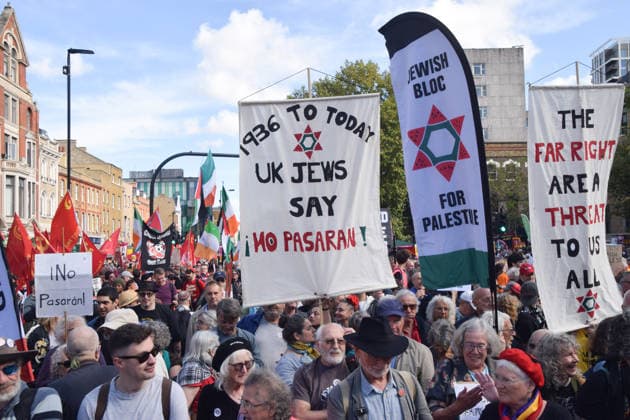 October 4, 2026, London, England, United Kingdom: Protesters gather in Whitechapel during the march to Cable Street against racism and fascism, marking the 90th anniversary since the Battle of Cable Street. London United Kingdom  - ZUMAv130 20261004_zip_v130_009 Copyright: xVukxValcicx