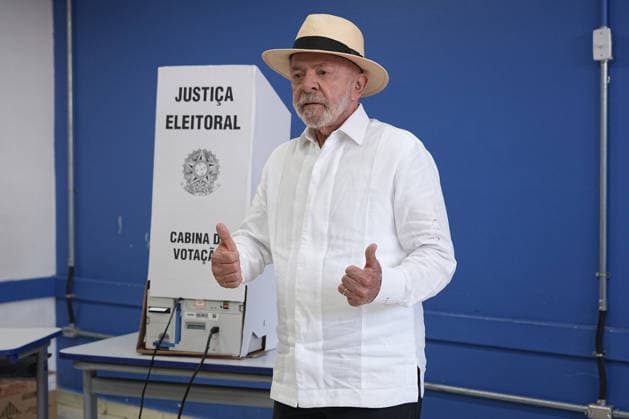 (261004) -- BRASILIA, Oct. 4, 2026 -- Brazilian President Luiz Inacio Lula da Silva, presidential candidate of Brazil s ruling Workers Party, gestures after casting his ballot at a polling station in Sao Bernardo do Campo, Brazil, Oct. 4, 2026. Voting in the first round of Brazil s 2026 presidential election officially began at 8 a.m. (1100 GMT) on Sunday, with polling stations across the country scheduled to close at 5 p.m. (0800 GMT). Initial results are expected to be announced within a few hours after the polls close. (Photo by Xinhua) BRAZIL-PRESIDENTIAL ELECTION-VOTING PauloxLopes 