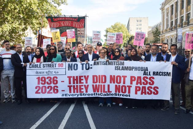 October 4, 2026, London, England, United Kingdom: Protesters march in Whitechapel to Cable Street against racism and fascism, marking the 90th anniversary since the Battle of Cable Street. London United Kingdom  - ZUMAv130 20261004_zip_v130_013 Copyright: xVukxValcicx