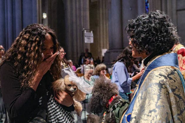 October 4, 2026, New York, New York, United States: The Very Reverend WINNIE VARGHESE, Dean of the Cathedral of St. John the Divine, gives a blessing to animals beneath Gaia, the seven-metre illuminated Earth installation by British artist LUKE JERRAM, in New York. The annual Blessing of the Animals, held in celebration of the Feast of St. Francis of Assisi, brings people and their beloved pets together at the Cathedral, honouring the relationship between people, animals and the natural world. New York United States - ZUMAo116 20261004_znp_o116_006 Copyright: xBiancaxOterox