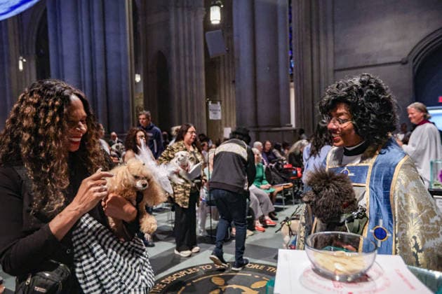 October 4, 2026, New York, New York, United States: The Very Reverend WINNIE VARGHESE, Dean of the Cathedral of St. John the Divine, gives a blessing to animals beneath Gaia, the seven-metre illuminated Earth installation by British artist LUKE JERRAM, in New York. The annual Blessing of the Animals, held in celebration of the Feast of St. Francis of Assisi, brings people and their beloved pets together at the Cathedral, honouring the relationship between people, animals and the natural world. New York United States - ZUMAo116 20261004_znp_o116_007 Copyright: xBiancaxOterox