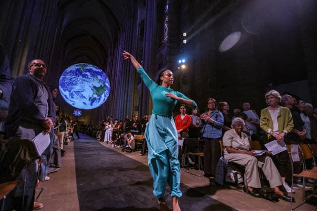 October 4, 2026, New York, New York, United States: Members of the Forces of Nature Dance Theatre Company perform beneath Gaia, the monumental illuminated Earth installation by British artist LUKE JERRAM, during the annual Blessing of the Animals at the Cathedral of St. John the Divine in New York. The celebration, held in honour of the Feast of St. Francis of Assisi, brings together dance, music, animals and their human companions in a celebration of the natural world. New York United States - ZUMAo116 20261004_znp_o116_010 Copyright: xBiancaxOterox
