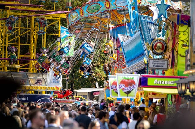 Oktoberfest 2026 in Munich, October 4, 2026: Numerous visitors among the rides at Oktoberfest. The 191st Oktoberfest took place from September 19 to October 4, 2026, at the Theresienwiese. The Munich Oktoberfest is one of the largest folk festivals in the world and attracts millions of visitors from Germany and abroad every year. Munich