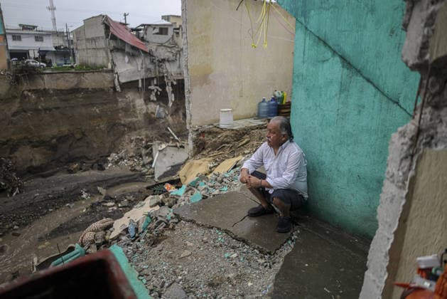 Heavy rains linked to El Nino trigger severe land collapse in Guatemala SAN MIGUEL PETAPA, GUATEMALA - OCTOBER 04: Residents try to go on with their daily lives amid severe damage and collapsed structures in the Villa Hermosa I neighborhood following relentless rainfall and the overflow of the Pinula River in San Miguel Petapa, Guatemala on October 04, 2026. The rising waters, linked to the El Nino phenomenon, triggered extensive riverbank erosion and land loss, damaging several homes and leaving nearby properties at continuous risk of collapse. Luis Vargas Anadolu San Miguel Petapa Guatemala. Editorial use only. Please get in touch for any other usage.  Copyright: x2026xAnadoluxLuisxVargasx