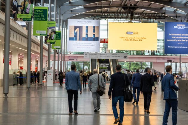 EXPO REAL 2026 in Munich, October 5, 2026: Trade visitors on their way to the exhibition halls at the Messe München grounds. First day of EXPO REAL 2026, the international trade fair for real estate, investments, and infrastructure will take place from October 5 to 7, 2026, in Munich, bringing t