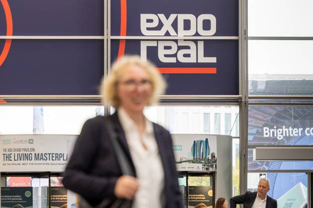 EXPO REAL 2026 in Munich, October 5, 2026: A female trade visitor on her way to the exhibition halls at the Messe München grounds. First day of EXPO REAL 2026, the international trade fair for real estate, investments, and infrastructure will take place in Munich from October 5 to 7,