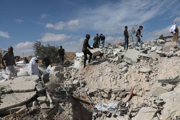 Israeli Army Demolishes Palestinian Building South of Hebron Israeli army vehicles demolish a Palestinian building in the village of al-Deirat near Yatta, south of Hebron, in the West Bank, on October 5, 2026, as Israeli forces deploy around the site and Palestinians watch the demolition. Photo by Mamoun Wazwaz apaimages Hebron West Bank Palestinian Territory 051026_Hebron_MW_00(37) Copyright: xapaimagesxMamounxWazwazx xapaimagesx