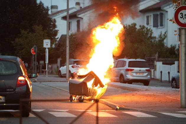 October 5, 2026, Anglet, Nouvelle Aquitaine, France: A waste container burns in the street during a protest by high school students against the government outside the Cantau high school in Anglet, southwestern France, on October 5, 2026. Students have been blocking schools across France since September 21 to demand more teachers, smaller classes and better school buildings. Cantau was closed by authorities after clashes in recent days. Anglet France  - ZUMAb298 20261005_zsp_b298_013 Copyright: xJulesxBuonx