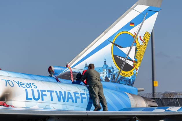 Eurofighter at Nuremberg Airport: German Air Force Practices Dispersed Operations, Nuremberg, October 5, 2026 A German Air Force technician works on the tail of a Eurofighter from Tactical Air Force Wing 74, featuring the special 70 Years of the German Air Force livery. The German Air Force is conducting tests at the airport to how 20261005-1V9A1226-M4000
