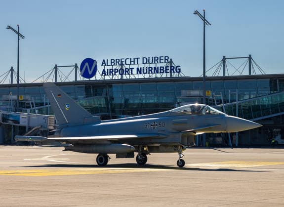 Eurofighter at Nuremberg Airport: German Air Force Conducts Dispersed Operation, Nuremberg, October 5, 2026 A German Air Force Eurofighter Typhoon with the tail number 31 50 taxis across the apron at the airport. The German Air Force is conducting tests there to determine how fighter jets and ground crews can temporarily operate out of a civilian airport. Nuremberg Airport, Bavaria, German 20261005-286A0089-M4000