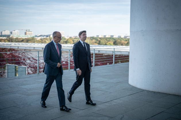 Chancellor Friedrich Merz with his guest Mindaugas Sinkeviciusius, Prime Minister of Lithuania, at the Federal Chancellery; on the terrace of the Federal Chancellery overlooking the Reichstag building, home to the Bundestag; the Federal Chancellor welcomes the Prime Minister of the Republic of Lithuania at the Federal Chancellery, Berlin, Germany; Federal Chancellery