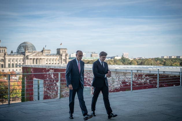 Chancellor Friedrich Merz with his guest Mindaugas Sinkeviciusius, Prime Minister of Lithuania, at the Federal Chancellery; on the terrace of the Federal Chancellery overlooking the Reichstag building, which houses the Bundestag; the Federal Chancellor receives the Prime Minister of the Republic of Lithuania at the Federal Chancellery, Berlin, Germany; Federal Chancellery