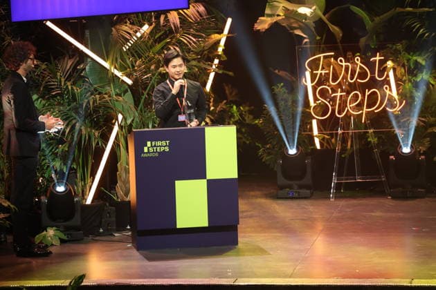 FIRST STEPS 2026: Laudatory speech by Karl Schirnhofer and winner of the Short Film category; winning film *BAN DAL* by Hae Sup Sin; award ceremony on stage at the FIRST STEPS 2026 awards ceremony at the Theater des Westens in Berlin Copyright: xEventpressxFuhrx