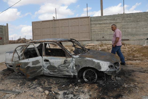 Palestinian Inspects Burned Vehicles Near al-Samu South of Hebron A Palestinian man inspects his burned vehicles near the town of al-Samu, south of Hebron, in the West Bank, on October 6, 2026, after an apparent arson attack believed to have been carried out by Israeli settlers. The incident comes amid an increase in settler attacks on Palestinians and their property in different areas of the West Bank. Photo by Mamoun Wazwaz apaimages Hebron West Bank Palestinian Territory 061026_Hebron_MW_00(16) Copyright: xapaimagesxMamounxWazwazx xapaimagesx