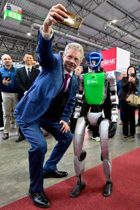 Czech Senate President Milos Vystrcil takes a selfie with a humanoid robot at opening of the 67th International Engineering Fair, which begins at Vystaviste 1 exhibition grounds in Brno, Czech Republic, on October 6th, 2026. International Fair of Machine Tools and Forming Machines IMT, International Welding Engineering Fair Welding, International Fair of Plastics, Rubber and Composites Plastex, International Fair of Surface Treatment Technologies Profintech and International Foundry Fair Fond-Ex also start. (CTKxPhoto VaclavxSalek) CTKPhotoP2026100605272  CTKPhotoP2026100605272