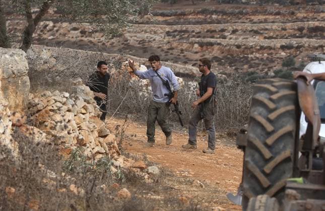 Palestinian farmers wounded in settler attack near Nablus AQRABA, OCCUPIED WEST BANK, OCTOBER 6, 2026: Palestinian farmers come under attack by Israeli settlers while harvesting olives in the village of Aqraba, south of Nablus. Several Palestinians were wounded after settlers opened fire and assaulted farmers during the harvest, according to Palestinian reports. Israeli forces later detained a Palestinian farmer at the scene, according to information provided by the photographer. The Israeli military had not immediately commented on the reported shooting. AQRABA Palestine, State of Copyright: x xNedalxShtiehx xJNAxPressx