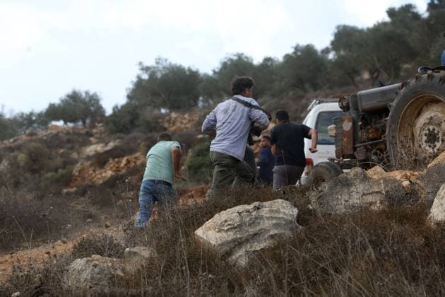 October 6, 2026, Aqraba, Palestine, State of: AQRABA, OCCUPIED WEST BANK, OCTOBER 6, 2026: Palestinian farmers come under attack by Israeli settlers while harvesting olives in the village of Aqraba, south of Nablus. Several Palestinians were wounded after settlers opened fire and assaulted farmers during the harvest, according to Palestinian reports. Israeli forces later detained a Palestinian farmer at the scene, according to information provided by the photographer. The Israeli military had not immediately commented on the reported shooting. Aqraba Palestine, State of - ZUMAq101 20261006_zna_q101_066 Copyright: xNedalxShtiehx