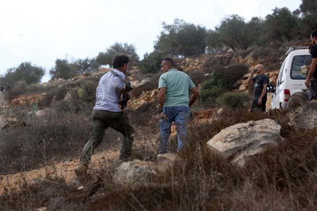October 6, 2026, Aqraba, Palestine, State of: AQRABA, OCCUPIED WEST BANK, OCTOBER 6, 2026: Palestinian farmers come under attack by Israeli settlers while harvesting olives in the village of Aqraba, south of Nablus. Several Palestinians were wounded after settlers opened fire and assaulted farmers during the harvest, according to Palestinian reports. Israeli forces later detained a Palestinian farmer at the scene, according to information provided by the photographer. The Israeli military had not immediately commented on the reported shooting. Aqraba Palestine, State of - ZUMAq101 20261006_zna_q101_069 Copyright: xNedalxShtiehx