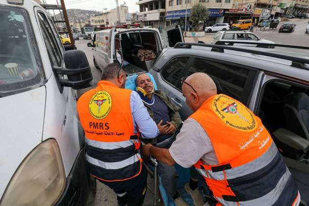Four Palestinians injured in attacks by Israeli settlers in Nablus NABLUS, WEST BANK, PALESTINE - OCTOBER 6: Agence France-Presse (AFP) photojournalist Jaafar Ashtiyeh, who is injured at the scene, is taken to hospital by ambulance following an Israelis attack Palestinian farmers harvesting olives on their land in the town of Aqraba, south of Nablus, West Bank, Palestine, on October 6, 2026. Nedal Eshtayah Anadolu Nablus West Bank. Editorial use only. Please get in touch for any other usage.  Copyright: x2026xAnadoluxNedalxEshtayahx