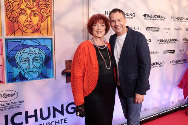 Regina Ziegler and Sebastian Fitzek attend the premiere of *Heimsuchung: The Beloved* at Kino International on October 6, 2026, in Berlin, Germany. *Heimsuchung: The Beloved* premiere in Berlin, Germany