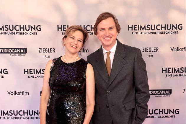 Martina Gedeck and Lars Eidinger attend the premiere of *Heimsuchung: The Beloved* at Kino International on October 6, 2026, in Berlin, Germany. *Heimsuchung: The Beloved* premiere in Berlin, Germany