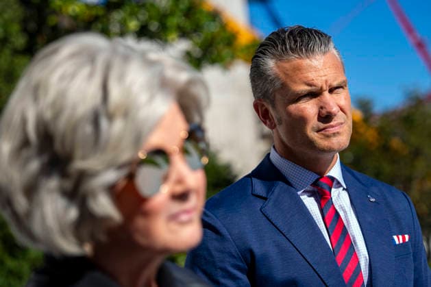 Secretary of Defense Pete Hegseth and White House Chief of Staff Susie Wiles look on as President Donald Trump speaks with reporters before boarding Marine One on the South Lawn of the White House in Washington, DC on Tuesday, October 6, 2026. The President is going to Baltimore, Maryland to deliver remarks at Anduril Industries, a tech company that builds robotic weapons and software for the military.  WAP20261006303 BONNIExCASH