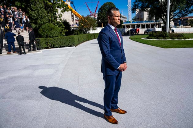 October 6, 2026, Washington, District Of Columbia, USA: United States Secretary of War Pete Hegseth looks on as US President Donald J Trump speaks with reporters before boarding Marine One on the South Lawn of the White House in Washington, DC on Tuesday, October 6, 2026. The President is going to Baltimore, Maryland to deliver remarks at Anduril Industries, a tech company that builds robotic weapons and software for the military Washington USA  - ZUMAs152 20261006_faa_s152_036 Copyright: xBonniexCashx-xPoolxviaxCNPx