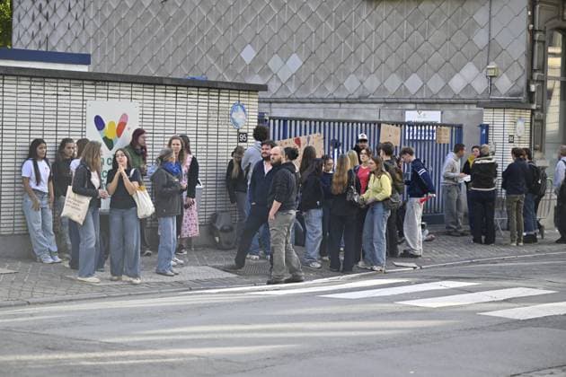 students gather outside Leoni de Waha school in Liege city center during a protest against education reforms and budget cuts, on Wednesday 7 October 2026. On Monday police arrested 16 people after the protests turned violent. About a hundred rioters continued to vandalize the city centre and face police on Tuesday. This Wednesday, police and Liege mayor called students to come back to school.  ERICxLALMAND 189036167