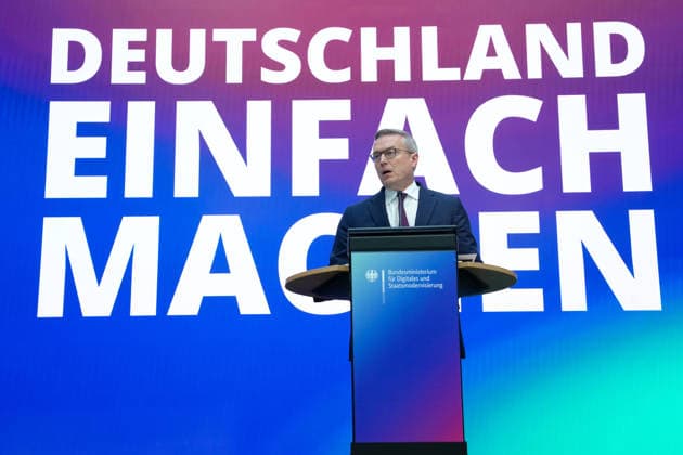 Statement by the Federal Minister for Digital Affairs on Government Modernization: Dr. Karsten Wildberger, Minister for Digital Affairs, on stage delivering a statement on the Cabinet’s decision regarding the report on one year of government modernization, Berlin, October 7, 2026, Berlin, Berlin, Germany