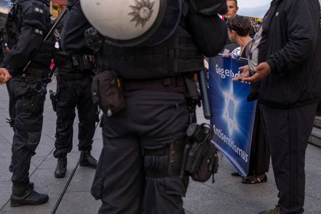 October 7, 2026, Cologne, Nrw, Germany: Multiple hundreds of people took part in a demonstration in Cologne marking the third anniversary of October 7, 2023, protesting IsraelÃ¢â‚¬â ¢s military campaign and genocidal intervention in Gaza. A smaller counter-protest took place without reported confrontations between the two groups...Police intervened and stopped the demonstration multiple times before protesters were held inside a police cage for approximately two hours. Officers later opened a corridor and allowed them to leave in small groups. During the dispersal, police arrested around 10 protesters, who were later released from custody. Cologne Germany  - ZUMAm356 20261007_zip_m356_004 Copyright: xMouafakxMahmaljix