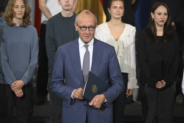 German Chancellor Friedrich Merz, British Prime Minister Andy Burnham attend Kensington Treaty ratification ceremony in Berlin BERLIN, GERMANY - OCTOBER 08: German Chancellor Friedrich Merz holds a document during a ceremony marking the exchange of instruments of ratification of the Kensington Treaty at the Federal Chancellery in Berlin, Germany, on October 08, 2026. British Prime Minister Andy Burnham and high school students also attend the ceremony. Halil Sagirkaya Anadolu Berlin Germany. Editorial use only. Please get in touch for any other usage.  Copyright: x2026xAnadoluxHalilxSagirkayax