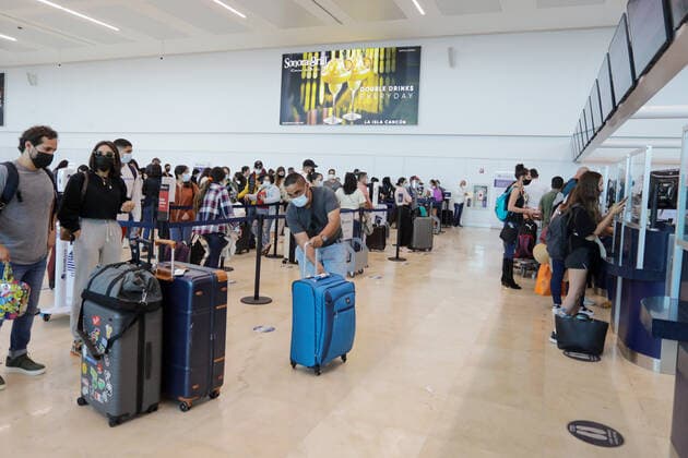 Mexico, holidaymakers arriving at Cancun International Airport