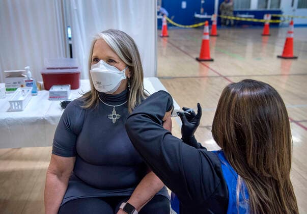 Coronavirus in the U.S., New Mexico governor gets vaccinated in Santa Fe