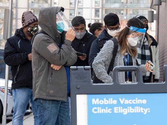 Coronavirus in Canada, snakes outside a Toronto vaccination center