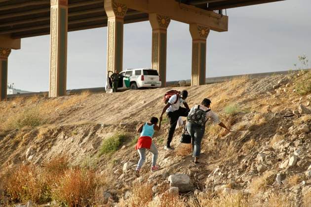 Mexico, migrants from Central America cross the border into the U.S. at the Rio Grande in Ciudad Juarez