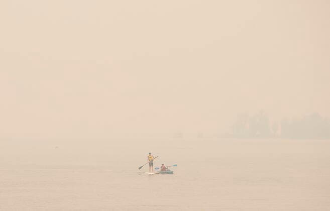 Canada, smoke from nearby forest fires over Sicamous, Alberta