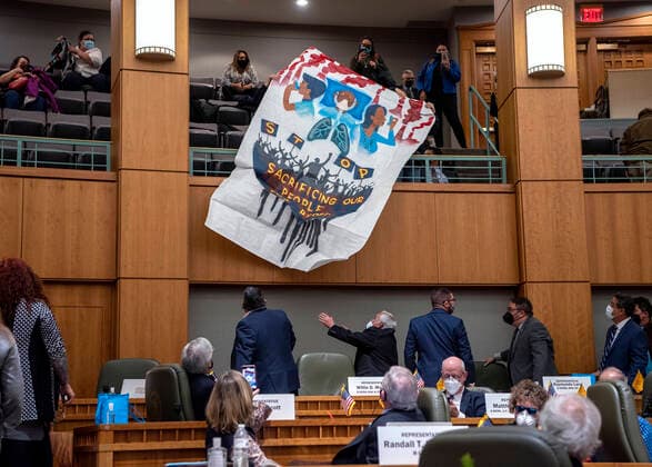 USA, Climate activists protest during a session of the New Mexico Legislature in Santa Fe.